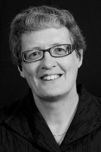 A black and white photo of Professor Grainne Moran's face. She is looking at the camera.
