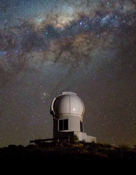 Telescope and night sky showing the Milky Way