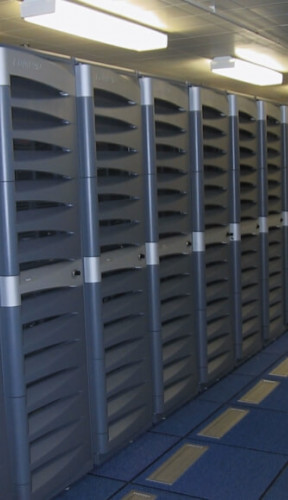 A bank of computer racks covered in grey plastic.