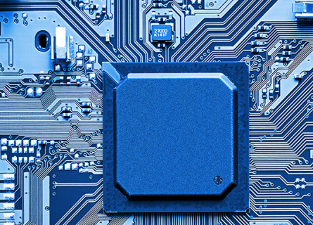 A blue image centred on a motherboard with a big computer chip.