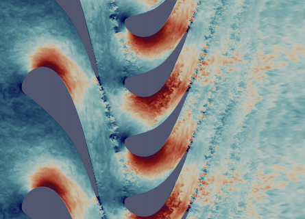 A view of turbulent air flows inside a gas turbine using Direct Numerical Simulation. Air in shades of blue (for slow) and red (for fast) swirl off from the tip of turbine blades.