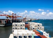 Container ships lined up against the docks in the Port of Brisbane.